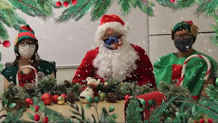 Masked Santa with masked Elves