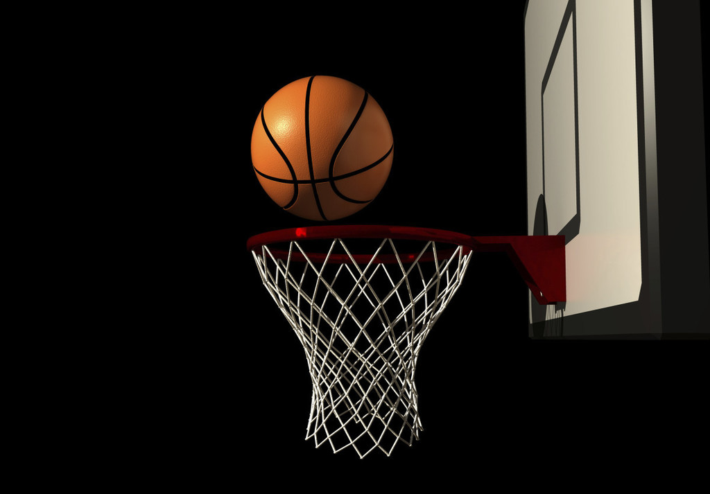 A basketball going into a hoop
