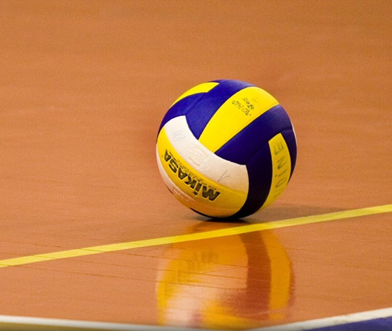 A Vollyball on a gym floor