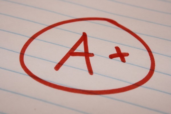 An "A+" marked on a paper.