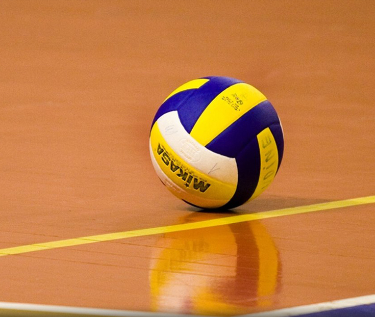 A volleyball on a gym floor